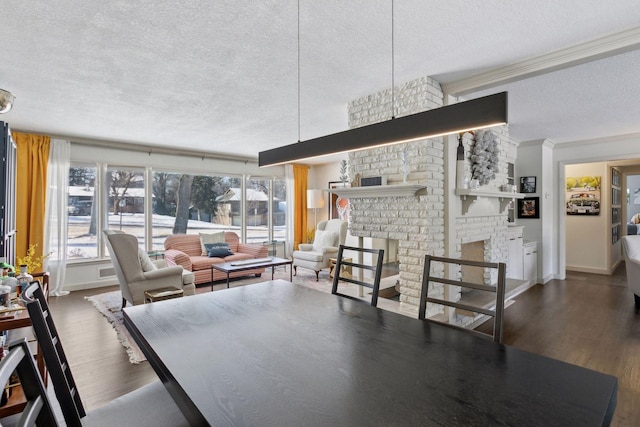 dining area featuring a fireplace, dark hardwood / wood-style floors, and plenty of natural light