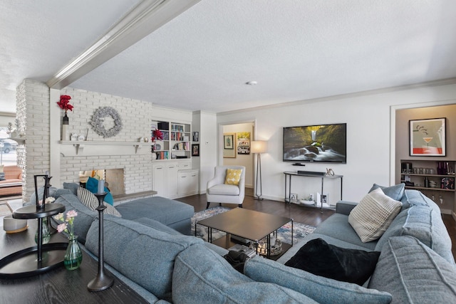 living room featuring dark hardwood / wood-style flooring, a fireplace, and a textured ceiling