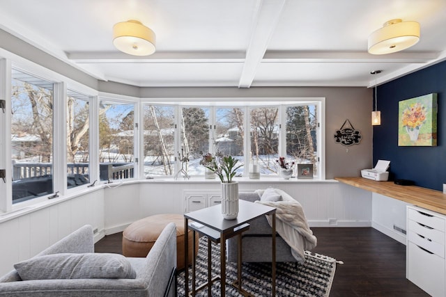 office area with plenty of natural light, beam ceiling, and dark hardwood / wood-style flooring