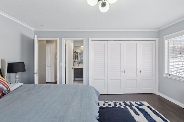 bedroom with dark hardwood / wood-style flooring, connected bathroom, ornamental molding, and a closet