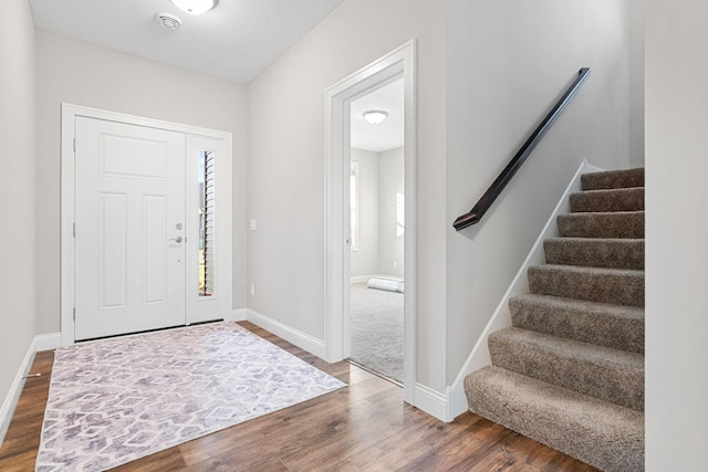 foyer with dark wood-type flooring