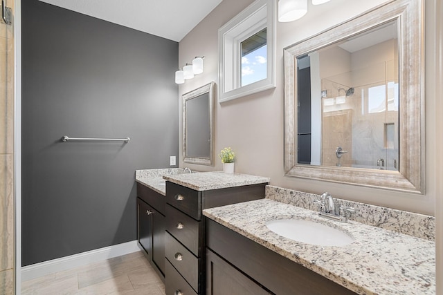 bathroom featuring vanity and an enclosed shower