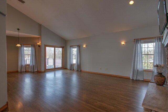 unfurnished living room featuring dark hardwood / wood-style floors and high vaulted ceiling