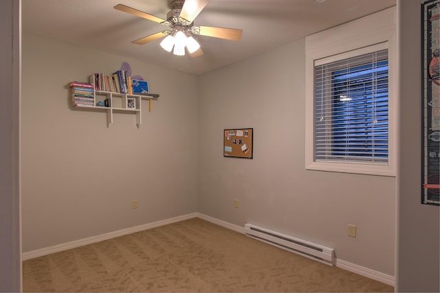 unfurnished room with a baseboard heating unit, ceiling fan, and carpet flooring