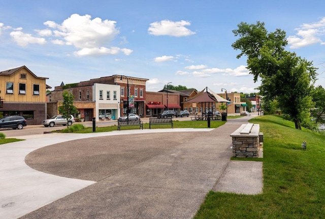 surrounding community featuring a playground and a lawn