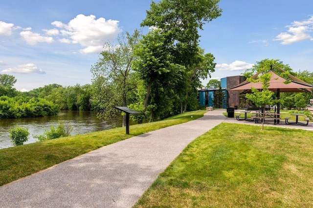 view of community featuring a gazebo, a lawn, and a water view