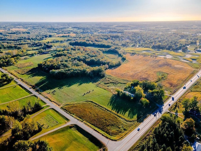 birds eye view of property with a rural view