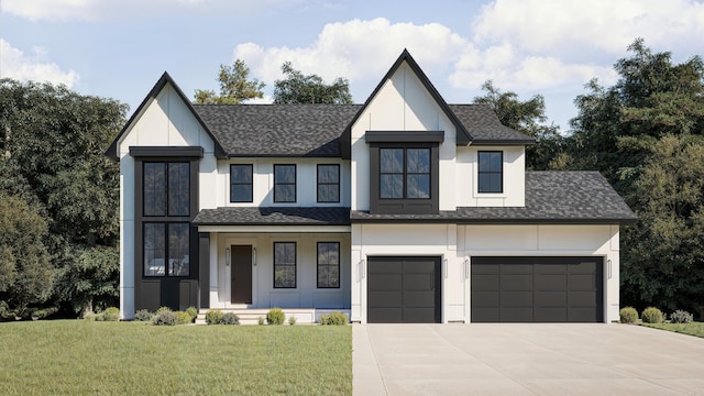 view of front of property featuring a garage and a front yard