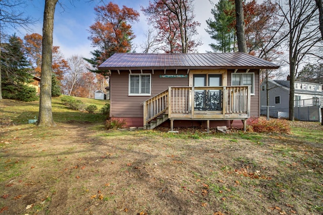 rear view of house with a lawn