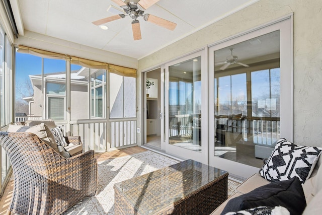 sunroom with a ceiling fan