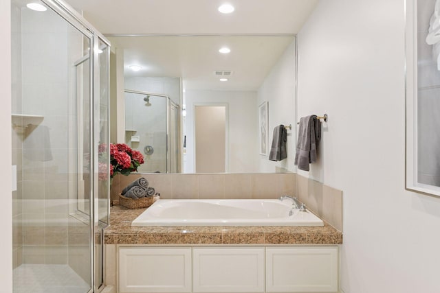 full bath featuring a garden tub, recessed lighting, visible vents, and a stall shower