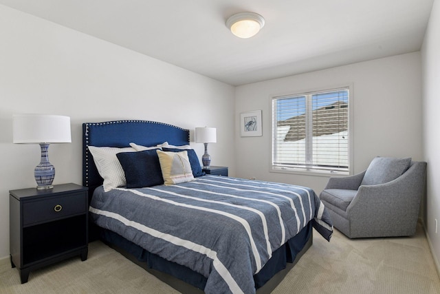 bedroom featuring light carpet