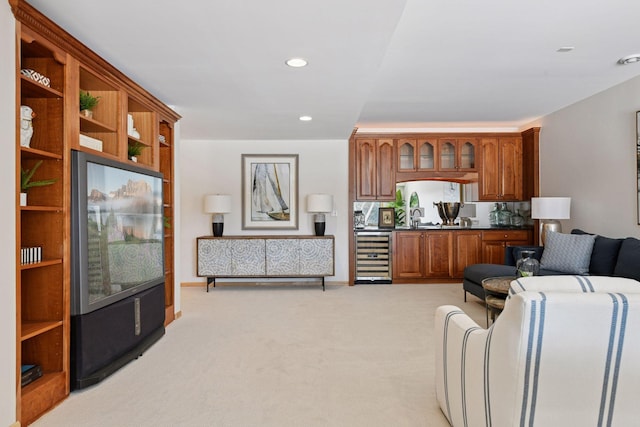 living area featuring wine cooler, recessed lighting, and light colored carpet