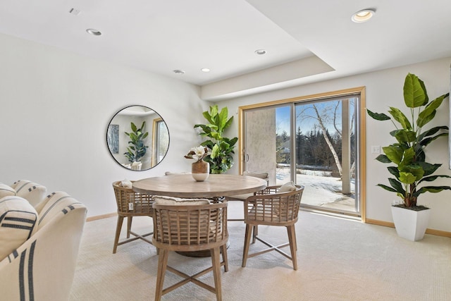 dining area with recessed lighting, baseboards, and light carpet