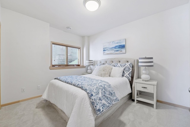 bedroom featuring baseboards and carpet floors