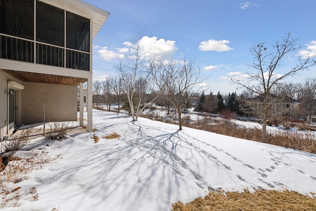 view of yard layered in snow