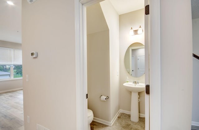 bathroom with sink and toilet