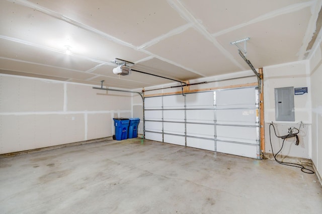 garage featuring a garage door opener and electric panel