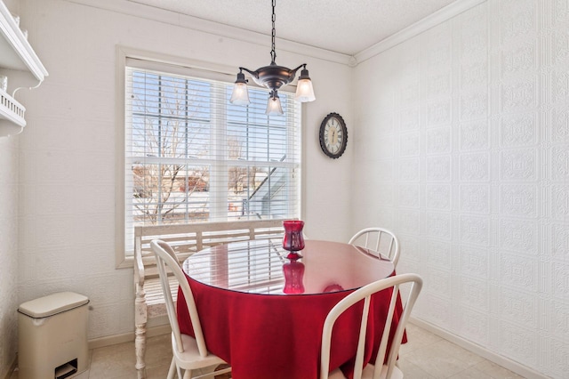 dining space with a notable chandelier, crown molding, and a textured ceiling