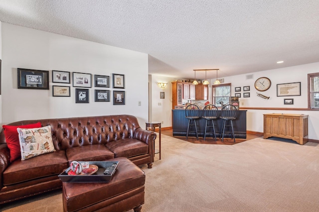 living room with carpet and a textured ceiling