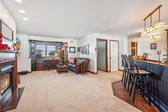 living room featuring carpet, a textured ceiling, and bar