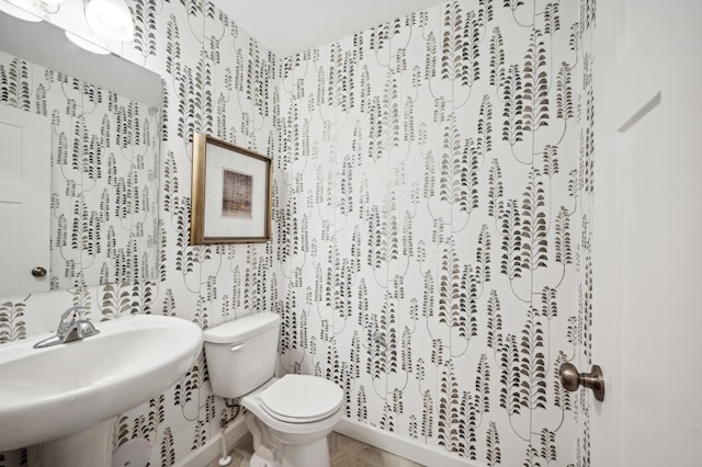 bathroom featuring sink and toilet