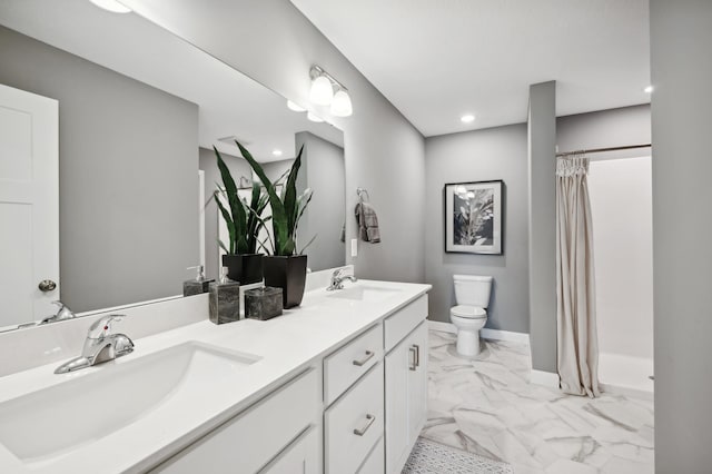 bathroom with vanity, toilet, and a shower with shower curtain