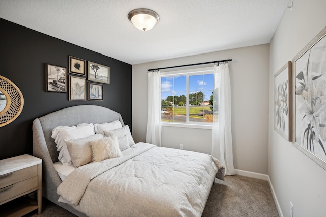 carpeted bedroom with a textured ceiling