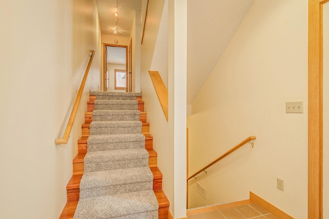 stairs with wood-type flooring