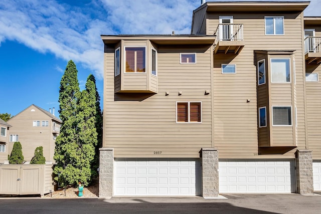 view of property exterior with a garage