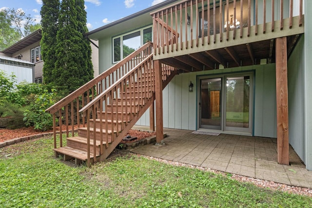 1541 2nd Ave SE, Cambridge, MN 55008 - back of house with stairway, a wooden deck, and a patio