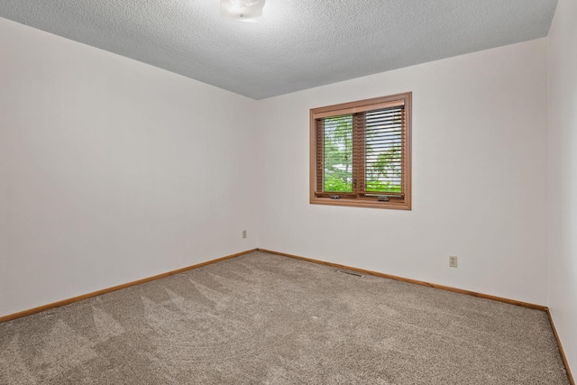 1541 2nd Ave SE, Cambridge, MN 55008 - carpeted spare room with baseboards and a textured ceiling