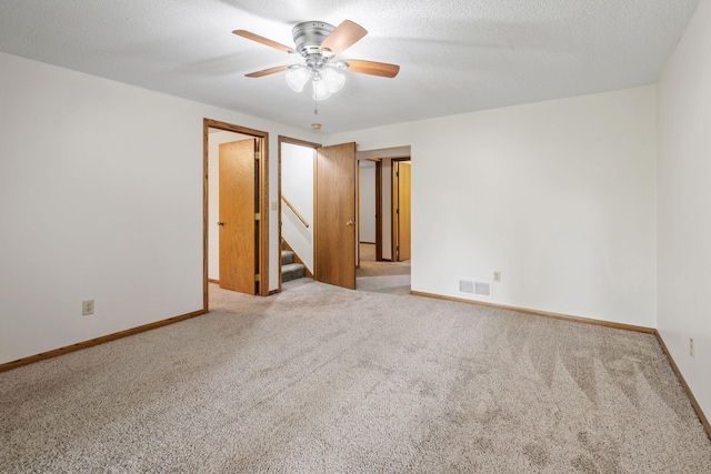 1541 2nd Ave SE, Cambridge, MN 55008 - unfurnished room with carpet floors, ceiling fan, and stairway