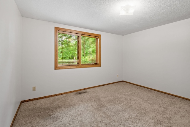 1541 2nd Ave SE, Cambridge, MN 55008 - carpeted spare room featuring baseboards and a textured ceiling