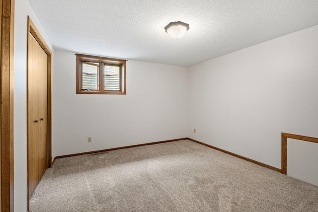 1541 2nd Ave SE, Cambridge, MN 55008 - unfurnished bedroom with carpet floors and a textured ceiling