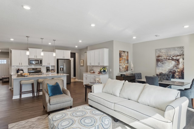 12450 Waterside Ct, Rogers, MN 55374 - living room featuring dark wood-style flooring and recessed lighting