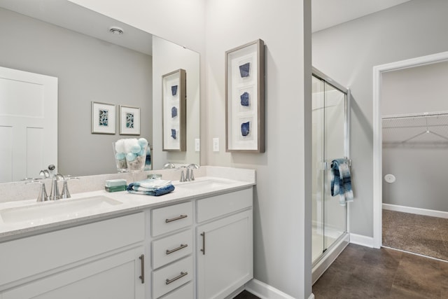 12450 Waterside Ct, Rogers, MN 55374 - full bath featuring a stall shower, double vanity, a spacious closet, and baseboards