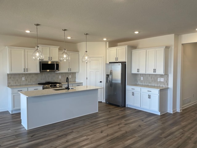 9662 49th St NE, Saint Michael, MN 55376 - kitchen featuring stainless steel appliances, decorative backsplash, white cabinetry, dark wood-type flooring, and recessed lighting
