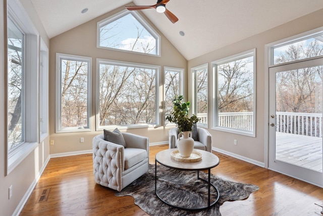 sunroom with vaulted ceiling and ceiling fan