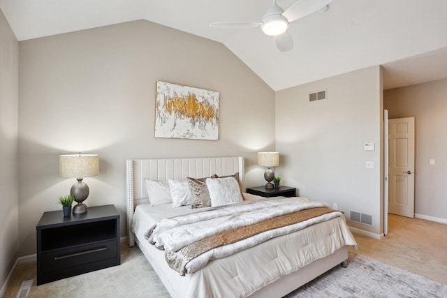 bedroom with vaulted ceiling, light colored carpet, and ceiling fan