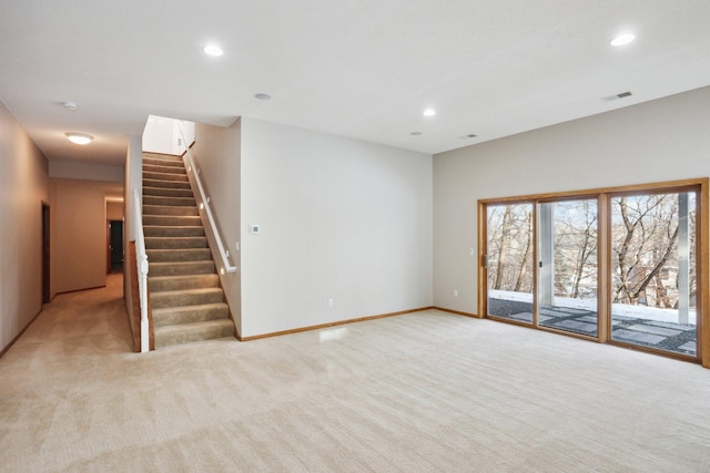 unfurnished living room with light carpet