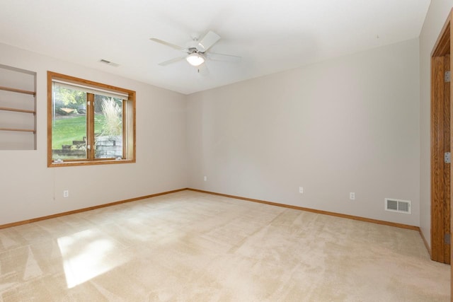 empty room with light carpet and ceiling fan