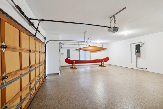 garage featuring a garage door opener and electric panel