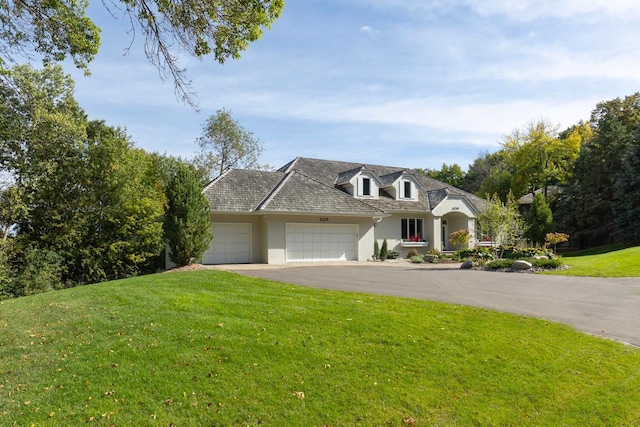 6229 Morningside Cir, Eden Prairie, MN 55344 - view of front of property featuring an attached garage, asphalt driveway, a front yard, and stucco siding