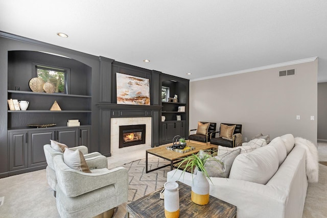 6229 Morningside Cir, Eden Prairie, MN 55344 - living room featuring ornamental molding, a premium fireplace, recessed lighting, built in shelves, and light carpet