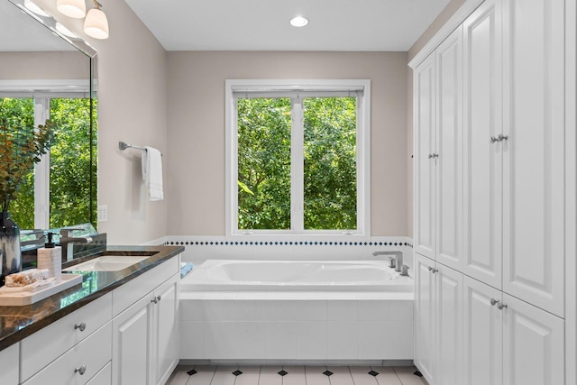 6229 Morningside Cir, Eden Prairie, MN 55344 - bathroom with vanity, a garden tub, recessed lighting, tile patterned floors, and a closet