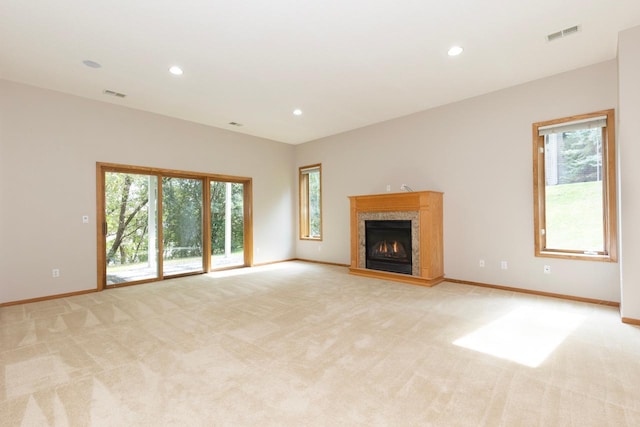 6229 Morningside Cir, Eden Prairie, MN 55344 - unfurnished living room featuring light carpet, a premium fireplace, plenty of natural light, and recessed lighting