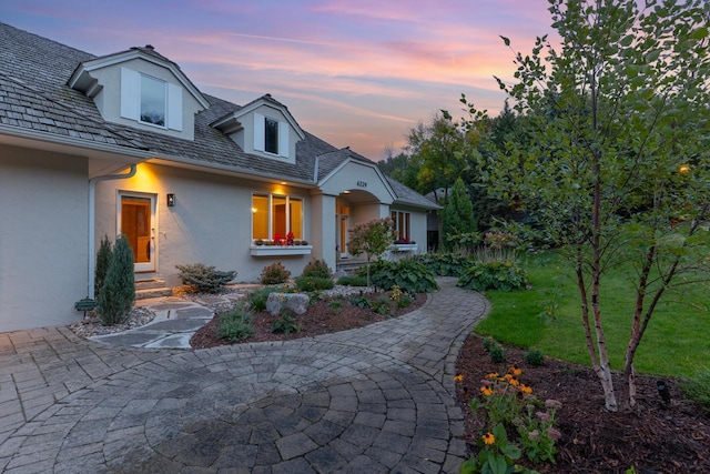 6229 Morningside Cir, Eden Prairie, MN 55344 - view of front of property with entry steps, stucco siding, and a yard