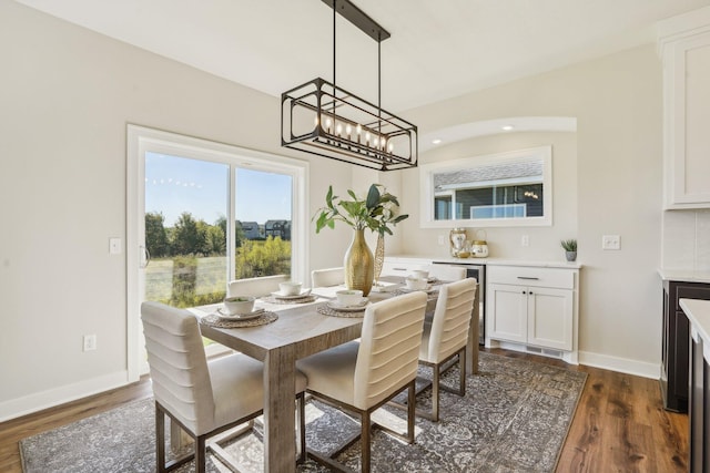 dining space featuring dark hardwood / wood-style floors