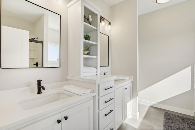 bathroom with vanity and an enclosed shower